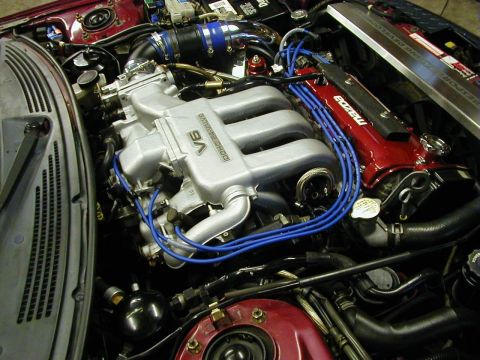 1994 Ford Probe - Close-up of a V6 engine bay, showing the intake manifold and valve covers.