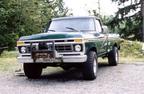 1977 Ford F-150 - This green Ford F-150 pickup truck is equipped with a heavy-duty bull bar and winch on the front.