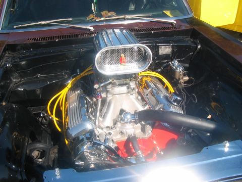 1986 Ford Bronco - A custom engine bay features chrome components and a prominent air filter, suggesting performance modifications.