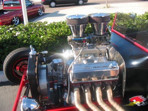 1986 Ford Bronco - Close-up of a Ford V8 engine dual carburetors and 'Ford Racing' valve covers.