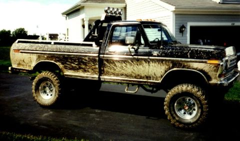 1979 Ford F-250 - This 1979 Ford F-250 pickup truck is covered in mud, indicating recent off-road use.