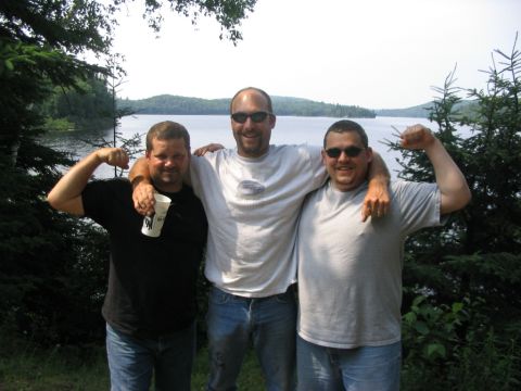 1986 Ford Bronco - Three friends enjoy a day by the water, showing off their muscles.