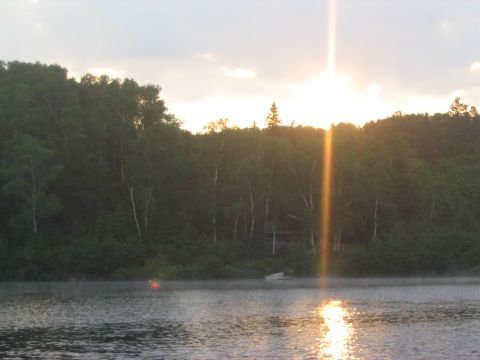 1986 Ford Bronco - Sunrise over a misty lake with a dense forest in the background.