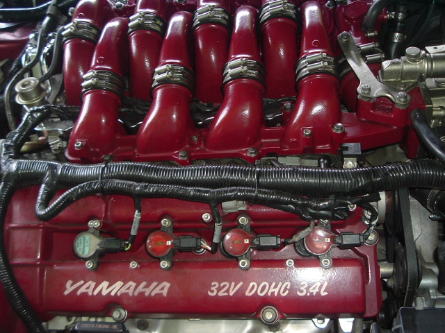 Red Yamaha 32V DOHC 3.4L engine with visible wiring and intake manifold
