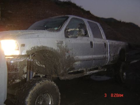 1977 Toyota Land Cruiser - This silver pickup truck is heavily covered in mud, suggesting it has been driven off-road. The timestamp indicates it was photographed on…