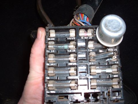 1978 Ford Mustang II - Close-up of a vehicle's fuse box, showing various fuses and labels for electrical circuits.
