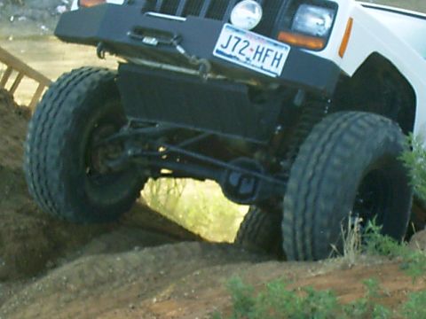 1986 Ford Bronco - This Jeep Cherokee is equipped with off-road tires and a custom front bumper.