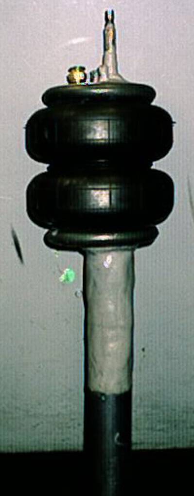 1989 Ford Tempo - Custom made Air strut, shortened 3" yea, I shortened the strut 3", welded a bag on the charged it back up...