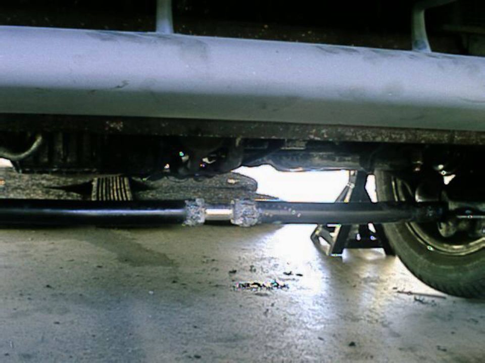 Yea, cut the front sway bar and installed a huge grade 8 bolt and nut, because the front anti-sway bar was a part of the front suspension, it located, the front spindels, so i couldn't remove it. so this would allow it to twist, yet still keep the spindels located. it's actually any easy design, because they don't move enough to become miss alligned.