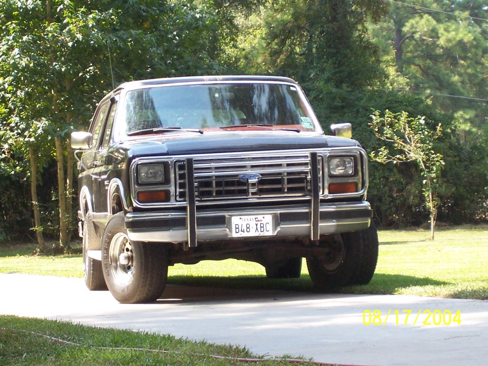 Front view of dark blue 1978 Ford F-150 with chrome grille guard and Texas license plate B4B-XBC