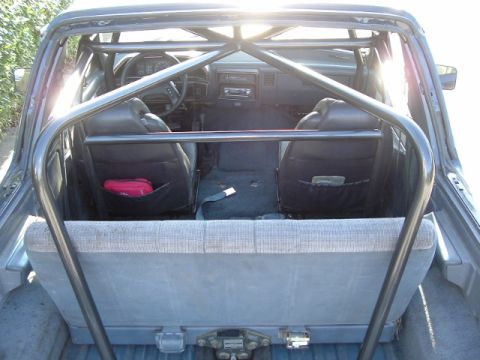 1989 Ford Bronco - This 1989 Ford Bronco features a prominent roll cage installed over the interior seating area.