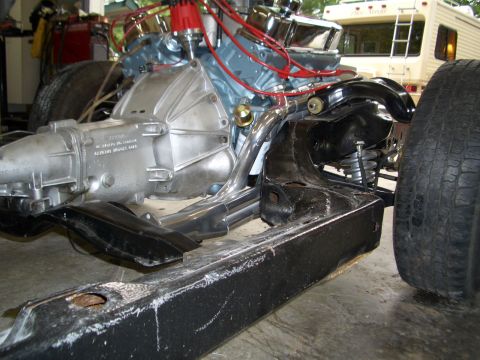 1967 Pontiac GTO - Close-up view of engine and transmission components mounted on a vehicle chassis.