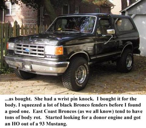 1988 Ford Bronco - This black 1988 Ford Bronco is shown from a 3/4 front angle, with its body style being the primary indicator of its year.