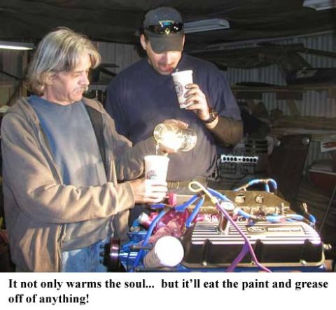 1988 Ford Bronco - Two men pour liquid into cups near an engine, with text about paint and grease.