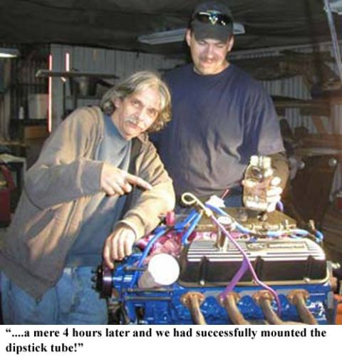 1988 Ford Bronco - Two men celebrate completing an engine rebuild, specifically mounting the dipstick tube.
