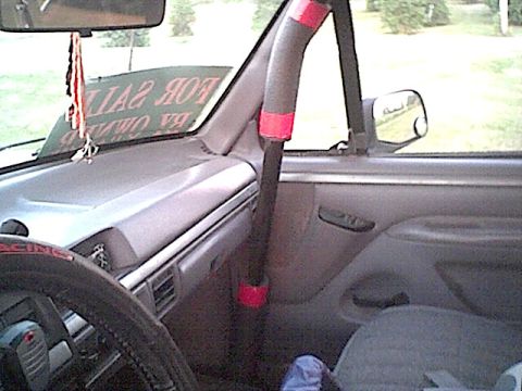 1994 Ford Bronco - Interior view of a 1994 Ford Bronco, including the dashboard and driver's side door.