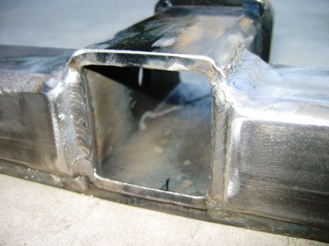1985 Ford Bronco - Close-up view of a fabricated front tow hitch receiver, showing the welded construction.