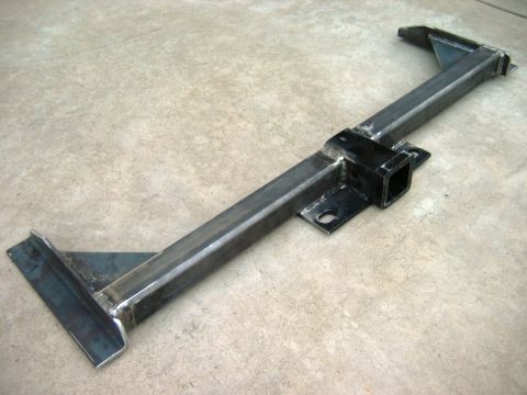 1985 Ford Bronco - Custom trailer hitch receiver fabricated from steel tubing, displayed on a concrete surface.