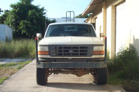 1997 Ford F-350 - Frontal view of a white Ford truck parked on a concrete surface.