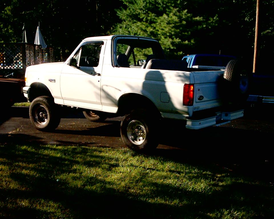 White 1996 Ford Bronco with spare tire mounted on rear