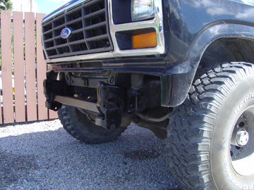 1986 Ford F-150 - Close-up of the front of a Ford F-Series truck, highlighting the grille and bumper modifications.
