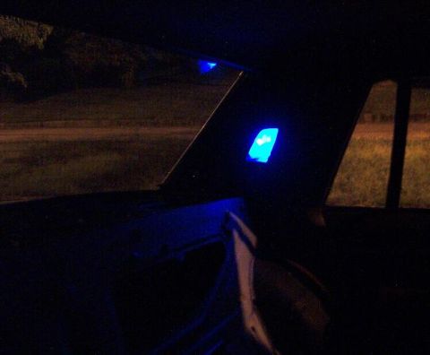 1985 Ford LTD Crown Victoria - Interior view of a car at night, illuminated by blue LED lights, with a website address visible in the lower right corner.