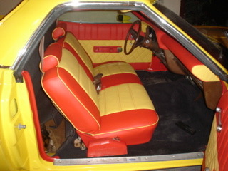 1974 Ford Ranchero - Interior view of a 1974 Ford Ranchero, showing the distinctive two-tone seating and door trim.