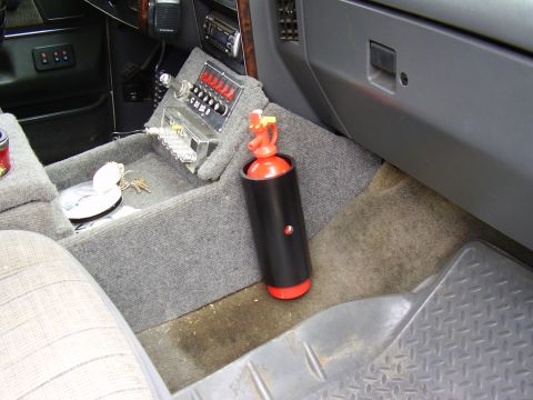 1990 Ford Bronco - Everybody should have an extinguisher, I just used 3" pvc, screwed to the side of the console, does not ratle out and is available!