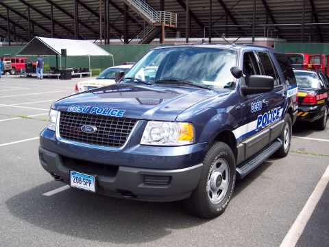 2001 Ford Crown Victoria - CCSU Police Ford Expedition SUV parked in a lot, with another police vehicle visible behind it.