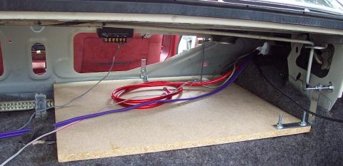 1985 Ford LTD Crown Victoria - Wiring and a custom board are installed in the trunk of a 1985 Ford Crown Victoria LTD.