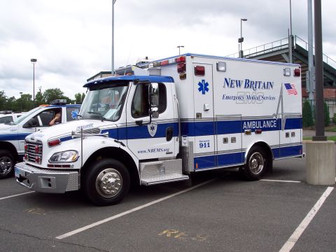 2001 Ford Crown Victoria - New Britain Emergency Medical Services ambulance with "911" and "AMBULANCE" text visible.