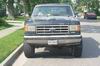 1988 Ford Bronco - Front view of a 1988 Ford Bronco parked on a residential street.