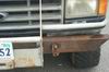 1988 Ford Bronco - Close-up of a white truck's front end, a rusty aftermarket bumper and grille.