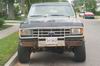 1988 Ford Bronco - Front view of a 1988 Ford Bronco parked on a residential street.