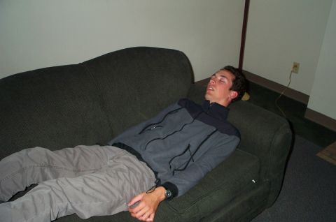 1996 Ford Bronco - A person is asleep on a sofa in a room. The person is wearing casual clothing.