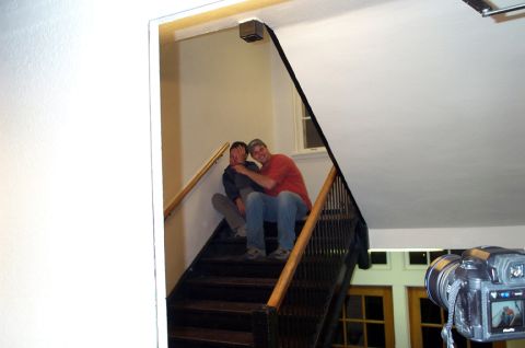 1996 Ford Bronco - Two individuals are seated on a dark wooden staircase, with a camera visible in the lower right corner.