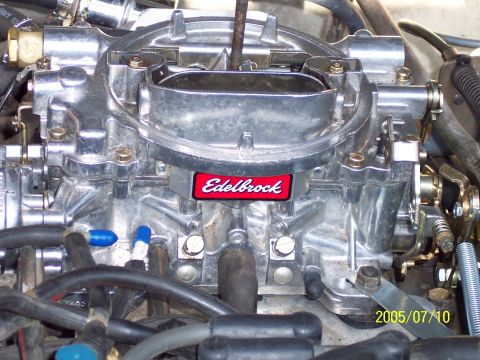 1985 Ford Bronco - Close-up view of an Edelbrock carburetor, showing its intricate mechanical details and branding.