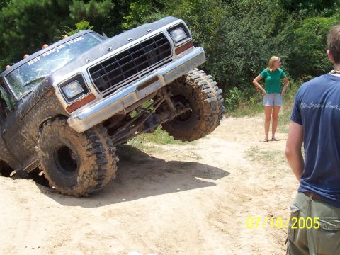 1987 Ford Bronco - This Ford Bronco appears to be from the late 1970s, not 1987, as it navigates a challenging off-road course.