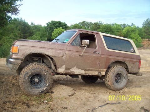 1987 Ford Bronco - 1987 Ford Bronco covered in mud after off-roading.