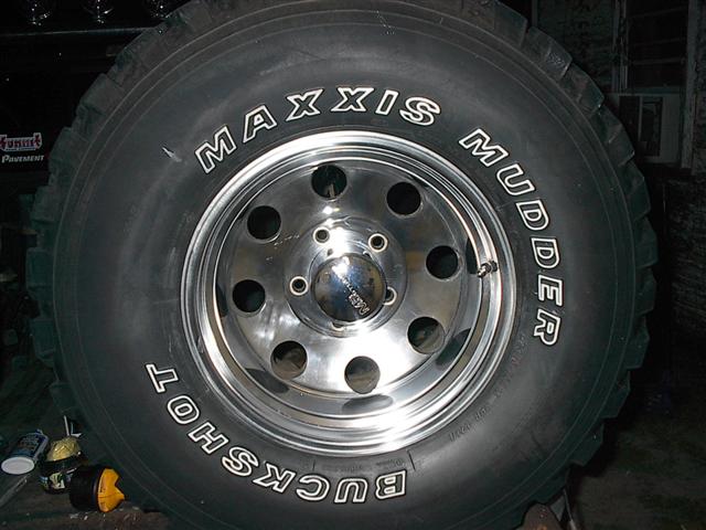 Maxxis Mudder Buckshot tire on a chrome wheel