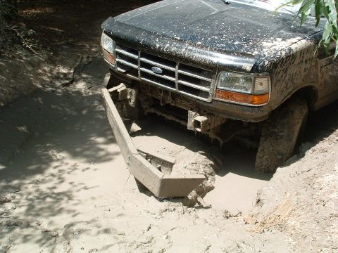 1993 Ford Bronco - This 1993 Ford Bronco is stuck in a muddy ditch.