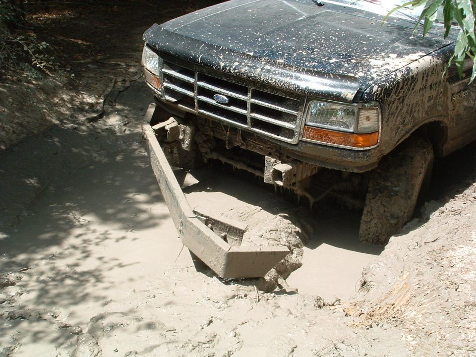 1993 Ford Bronco front bumper deep in mud, stuck off-road