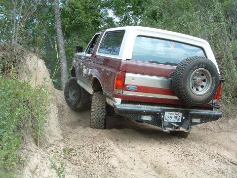 1993 Ford Bronco - This 1993 Ford Bronco navigates a steep dirt incline, its off-road capabilities.
