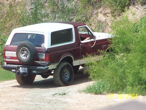 1987 Ford Bronco - This 1987 Ford Bronco is seen off-road, with its spare tire mounted on the rear tailgate.