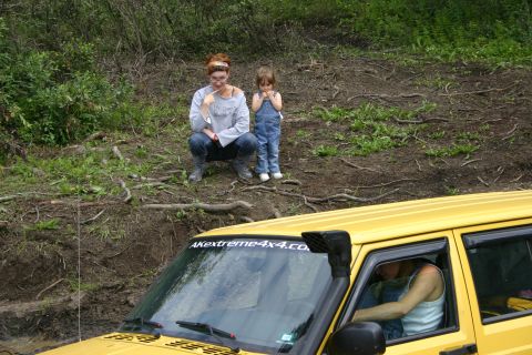 2003 Jeep TJ - A yellow 2003 Jeep TJ is shown with a snorkel and a website decal on the windshield.