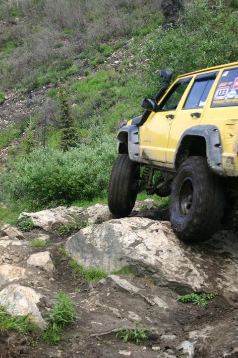 2003 Jeep TJ - This modified SUV navigates a rocky trail, its off-road capabilities.
