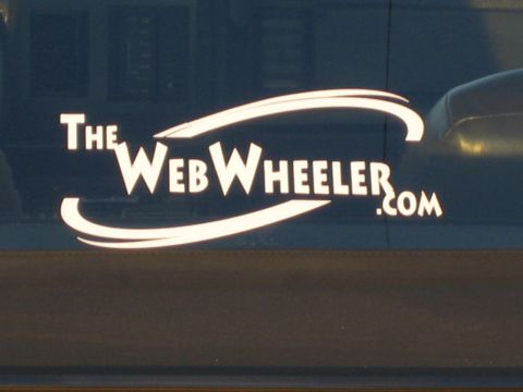 1985 Ford Mustang - A white logo with text "The WebWheeler.com" is visible on a dark blue surface, possibly a vehicle window.