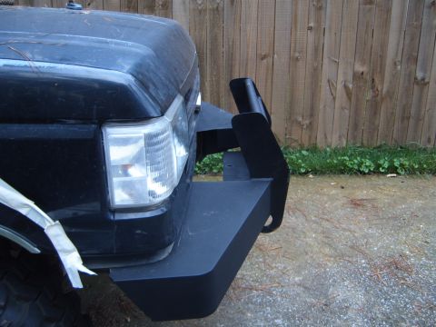 1988 Ford Bronco - Front view of a 1987 Ford Bronco showing its headlight and custom bumper.