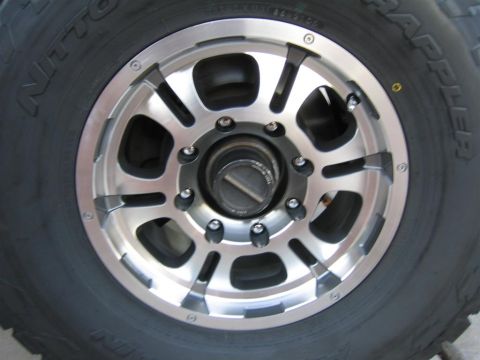1999 Ford F-250 - Close-up view of a wheel and tire, Nitto Terra Grapplers and a B&M wheel.