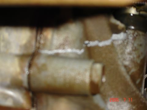 1993 Ford Bronco - This image shows a close-up of a corroded water pump part, not a 1993 Ford Bronco.